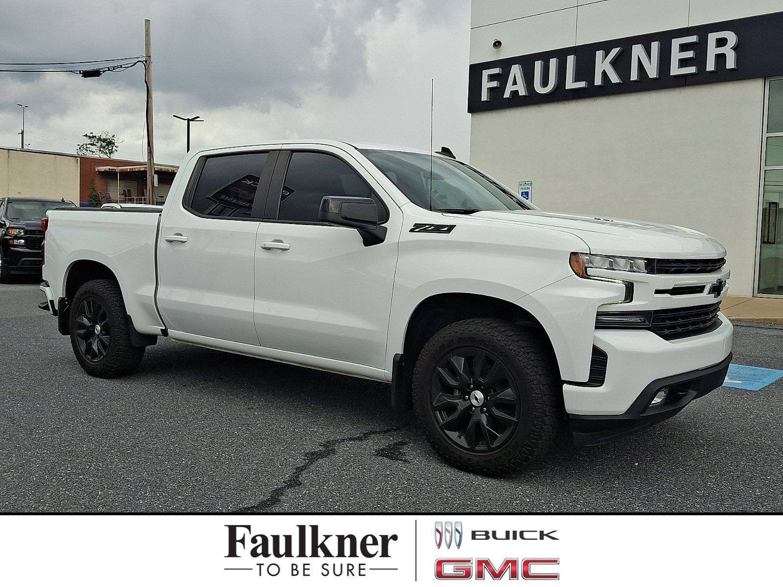 2021 Chevrolet Silverado 1500 RST in Summit White — front three-quarter view