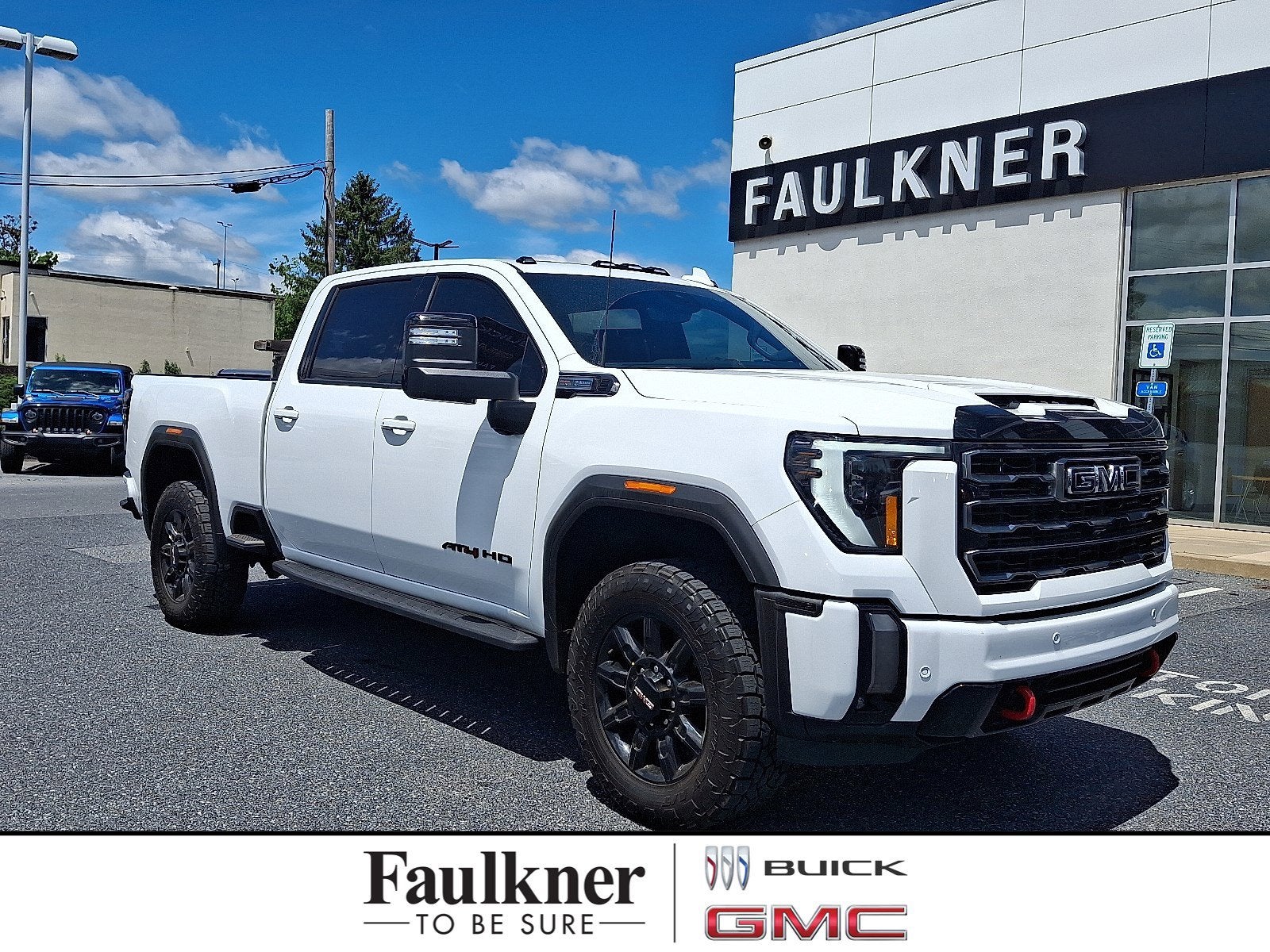 2024 GMC Sierra 2500 HD AT4 in Summit White — front three-quarter view