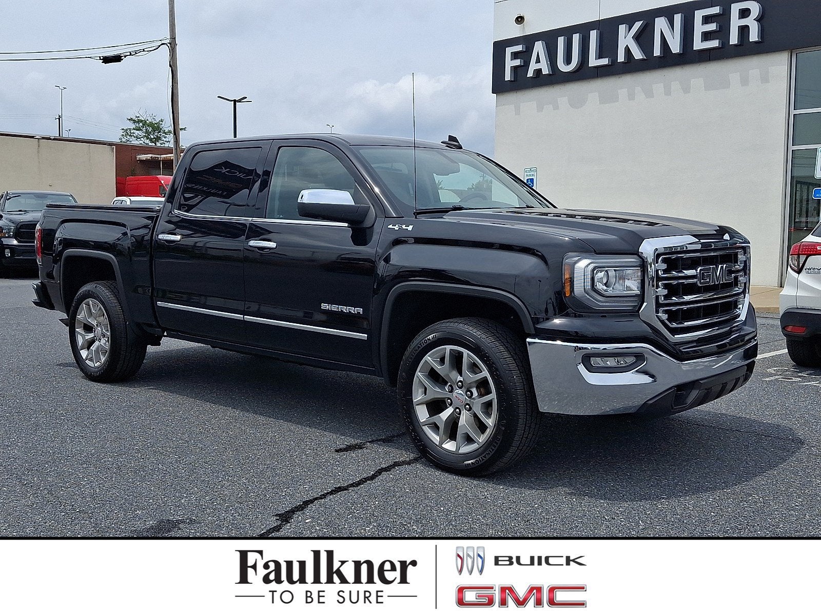 2018 GMC Sierra 1500 SLT in Onyx Black — front three-quarter view