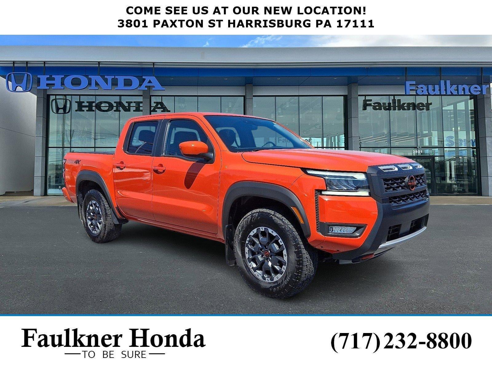 2025 Nissan Frontier Crew Cab 4x4 PRO-4X in Afterburn Orange — front three-quarter view