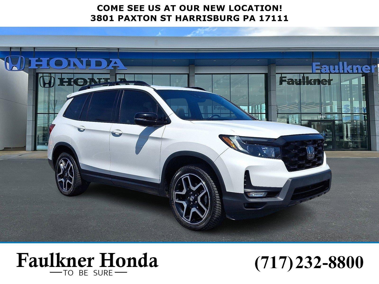 2023 Honda Passport Elite AWD in Platinum White Pearl — front three-quarter view
