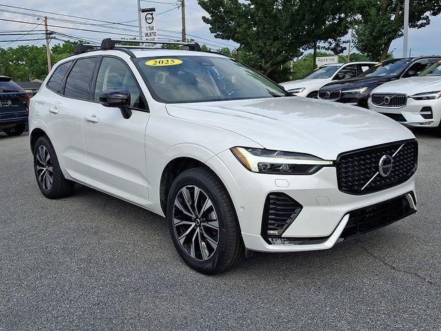 2025 Volvo XC60 B5 AWD Plus in Crystal White Metallic — front three-quarter view
