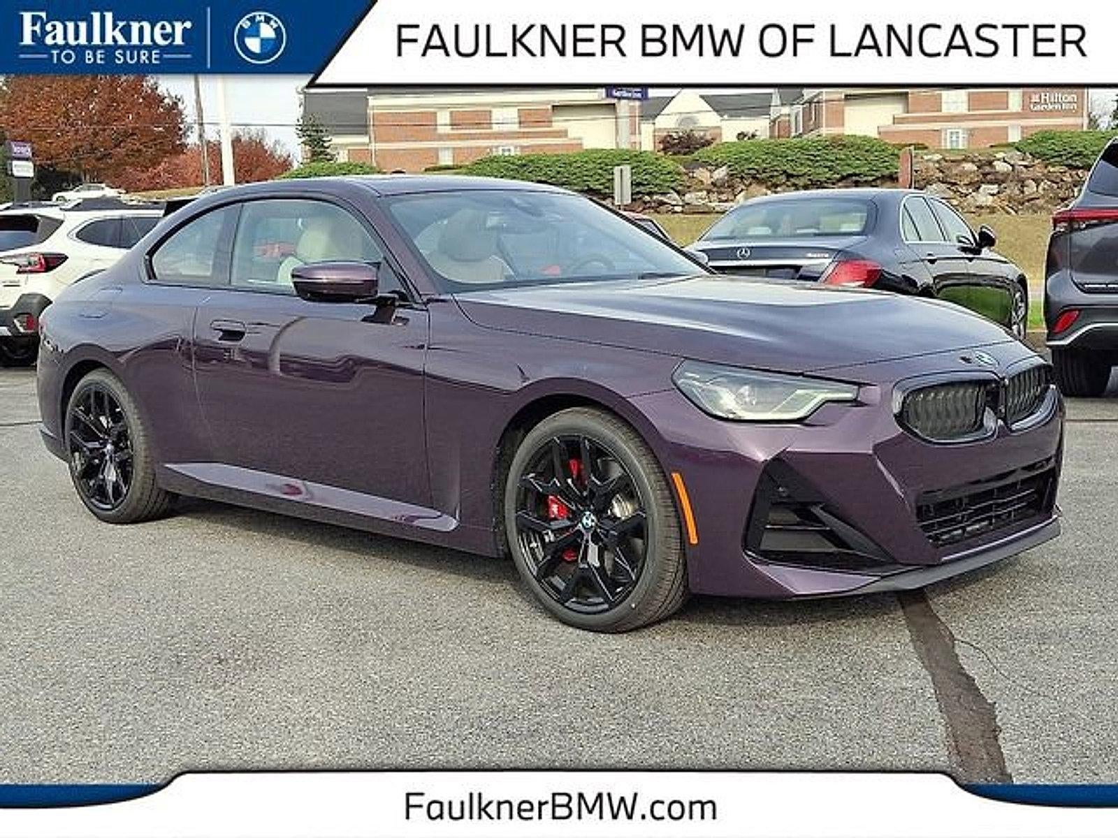 2026 BMW 230i xDrive Coupe in Thundernight Metallic — front three-quarter view