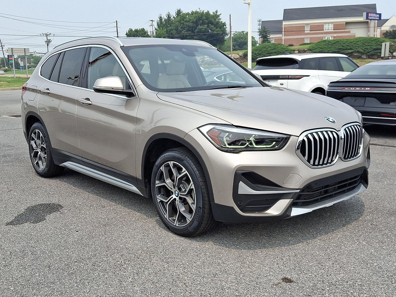 2021 BMW X1 xDrive28i Sports Activity Vehicle in Cashmere Silver Metallic — front three-quarter view